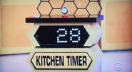 He bids $25 on the Kikkerland kitchen timer. A difference of $3. He picks card #17.