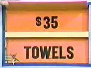 She keeps the towels. The wood products are $35 and go into the Give column.