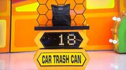 She bids $25 on the HOTOR car trash can. A difference of $7. She picks card #20.