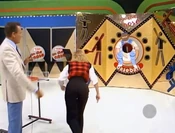 Her second throw went into the hole. She wins the Dodge Aries LE 2-seat wagon!