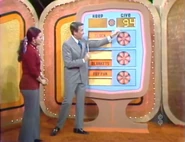 ...and goes into the give column, which now has a total of $94. She keeps the clock, blankets, and fry pan no matter what happens. But if they total $94 or more, she wins the recliners and color TV.