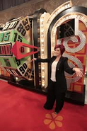 The Talk's Sharon Osbourne poses next to the Big Wheel during her appearance of "Celebrity Week".