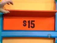 The earrings are $15 for a total of $41 thus far. If the disposal is $72 or more, she wins the sailboat.