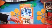 First, she picks 4 Kellogg's Frosted Mini-Wheats cereals which come to...