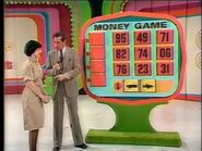 Here's Money Game played on the stage floor again, but now with the name on the board. Should you find the front of the car and the back of the car, its shape is black and the background is yellow seen here.