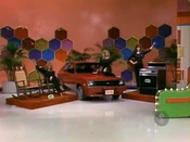 Edwin is playing for a 2-door Chevette hatchback, PLUS a pair of Melson Standard rockers and a Dacor range, a prize package worth $7,782.