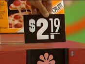 First, he picks the Tony's frozen pizza.
