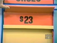 The cosmetics are $23 for a total of $63 thus far. If the shoes are $30 or more, he wins.