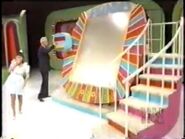 Here is the next look of Plinko. Notice the Plexiglass cover and extra rail on the stairs.