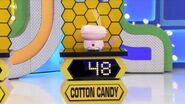 She bids $45 on the cotton candy maker. She picks card #28.