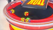 On her second roll, she has 3 dollar signs and $1,000. She decides to roll again.