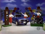 Kelly is playing for a Mazda B2000 Sundowner sport truck, PLUS a Pearl grandfather clock and a Honda 650 Nighthawk motorcycle, a prize package worth $11,058.