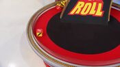 On her second roll, she has $500. She decides to roll again.