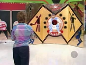 Her third throw went into the hole. She wins the Chevrolet Monte Carlo SS 2-door sport coupe!