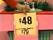 Rod tried correcting himself as Kathleen lifed the price card.