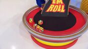On her first roll, she has 2 cars and $3,000. She decides to roll again.