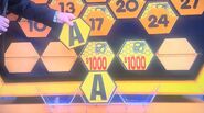 It's another A. $2,000 is now up for grabs. She decides to take the cash.
