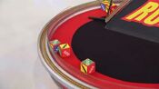 On his second roll, he has 1 car and $2,000. He decides to roll again.