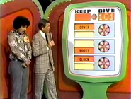 ...for a total of $101. He keeps the clock, boots, and cover no matter what happens. But if they total $101 or more, he wins the camping trailer.