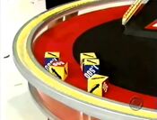 On her first roll, she has 4 cars and $500. She decides to roll again.