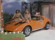 Chevy Corvette with Models.png (181 KB) A picture of the nighttime syndicated version of TPiR, with models Janice Pennington and Dian Parkinson sitting on top of a car with model, Linda Serine.