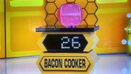 He bids $34 on the Lekue silicone bacon cooker. He picks card #16.