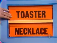 The first two prizes are a toaster and a necklace.
