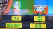 Amber says the V8 6pk Original vegetable juice is more expensive than the Healthy Choice Greek frozen yogurt.
