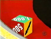 On her second roll, she has $1,000. She decides to roll again.