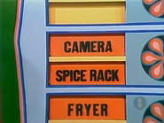 The next two prizes are a spice rack and a camera.