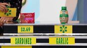 Merian says the Spice World squeeze garlic is more expensive than the King Oscar sardines.