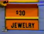 She keeps the jewelry. The hair dryer is $30, and it goes into the Give column.