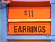 She keeps the earrings. The cosmetics are $11, and go into the Give column, which now totals $34.