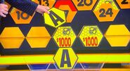 It's another A. $2,000 is now up for grabs, but the contestant decides to go for the car.