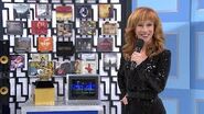 Comedienne Kathy Griffin smiles at the cameraman while presenting her Grammy-themed showcase