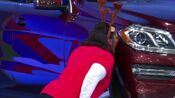 This contestant is so excited that she gave the car a kiss for good luck.