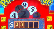 She says the third number is a 7 but is incorrect. The car is now $1.00.
