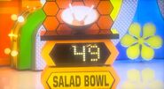 She bids $40 on the salad bowl & 2 spoons. A difference of $9. She picks card #23.