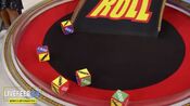 On her first roll, she has 3 cars and $2,500. She decides to roll again.