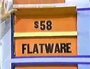 She keeps the flatware. The wok is $58 and goes into the give column...