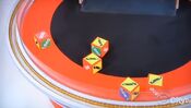 On his first roll, he has 4 cars and $500. He decides to roll again.