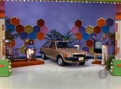 Scott is playing for a Mazda GLC hatchback, PLUS a pair of Albert M Lock rockers and a Zenith 25" color TV, a prize package worth $7,816.