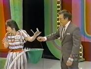 Her tenth and last draw is a 0. She wins the Pontiac Firebird!