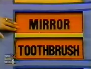 The next two prizes are a toothbrush and a mirror.