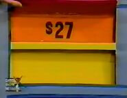 The mirror is $27 for a total of $53 in the keep column thus far. If the towels are $29 or more, she wins.