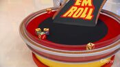 On her second roll, she has 3 cars and $1,000. She decides to roll again.