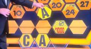 It's another A. $1,000 is still up for grabs, but the contestant decides to go for the car.