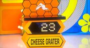 She bids $30 on the Zyliss rotary cheese grater. A difference of $16. She gets no card.