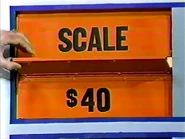 She keeps the scale. The perfume is $40 and goes into the Give column, doubling the total to $80.