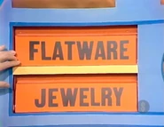 The last two prizes are jewelry and flatware.